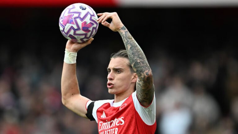 Arsenal player Ricardo Calafiori taking a throw-in in the Premier League