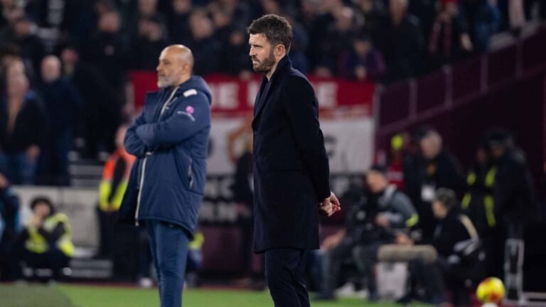 Michael Carrick on the touchline alongside Nuno Espirito Santo