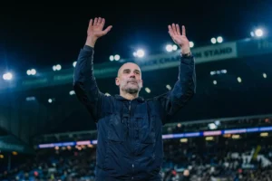 Pep Guardiola hailing the Manchester City visiting crowd after a league game at Elland Road