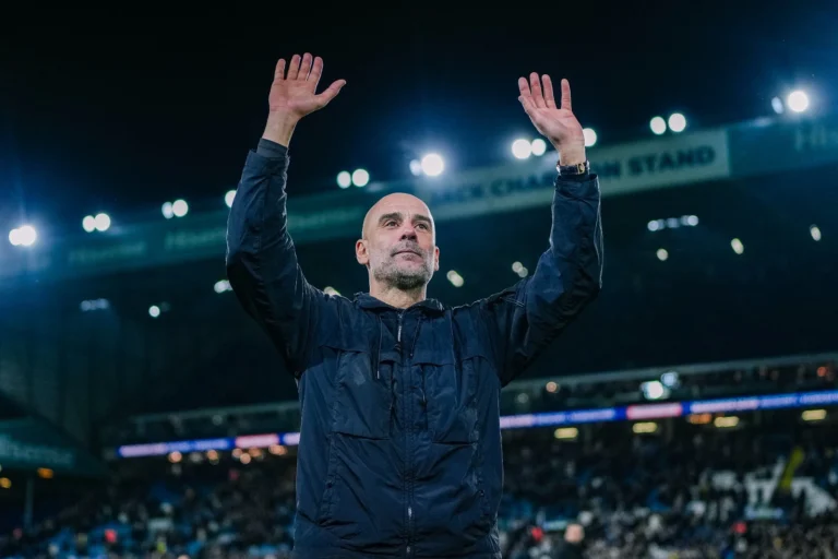 Pep Guardiola hailing the Manchester City visiting crowd after a league game at Elland Road