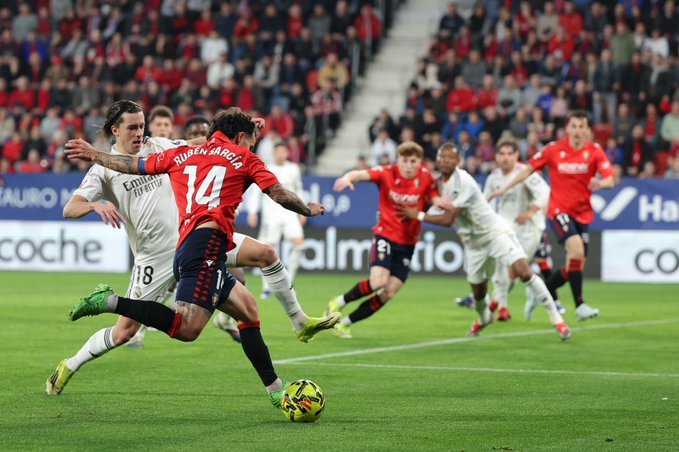 Osasuna players in action against Real Madrid