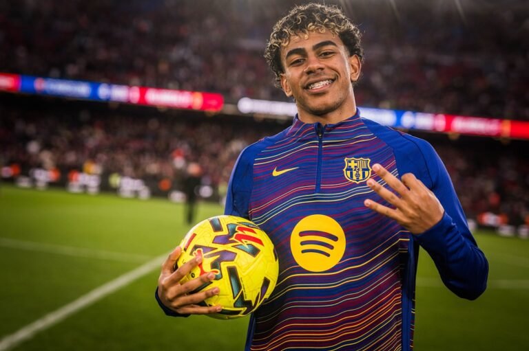 Lamine Yamal posing with a match ball after first career hat-trick against Villareal