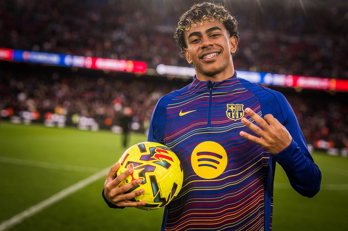 Lamine Yamal posing with a match ball after first career hat-trick against Villareal
