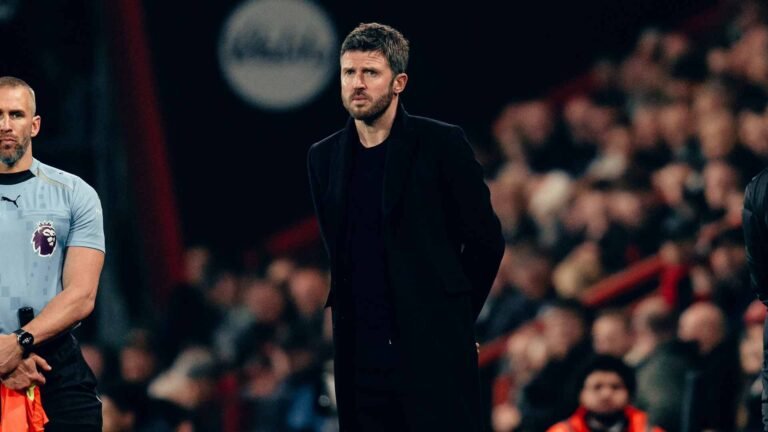 Manchester United coach Michael Carrick standing on the sidelines during a Premier League game