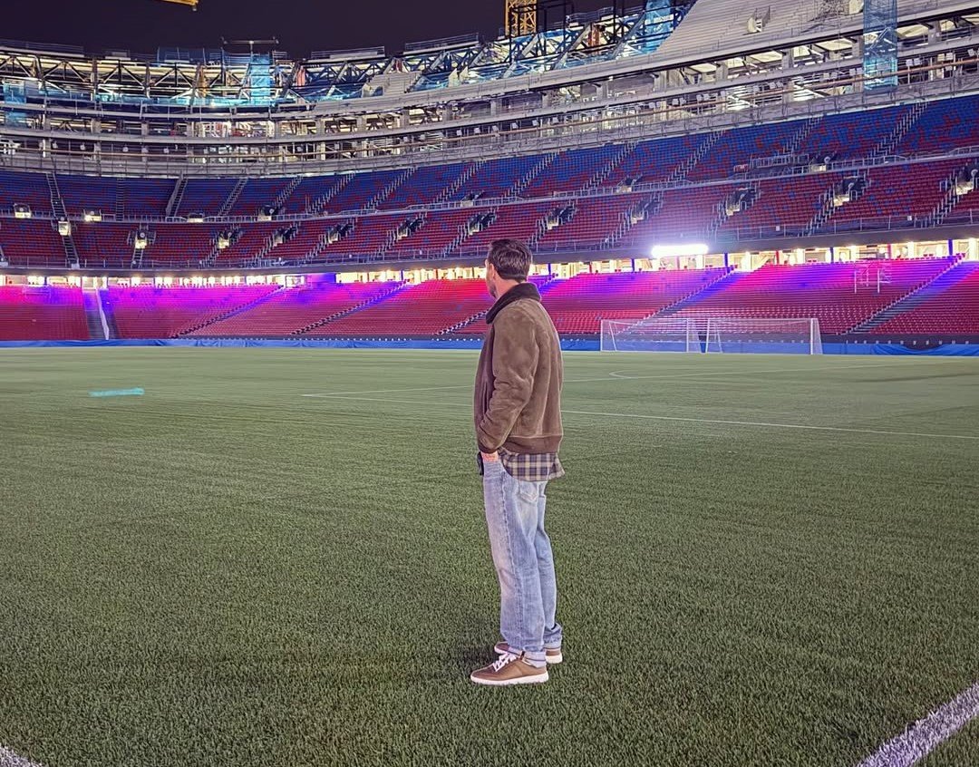 Lionel Messi standing at Camp Nou