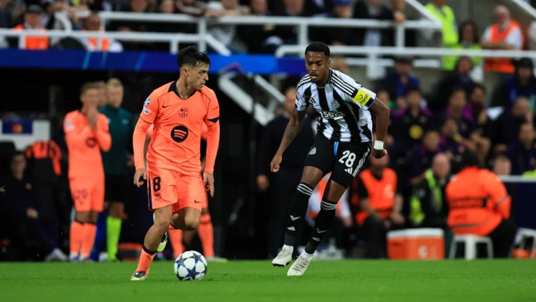 Barcelona midfielder Pedri facing off against Newcastle player in the Champions League