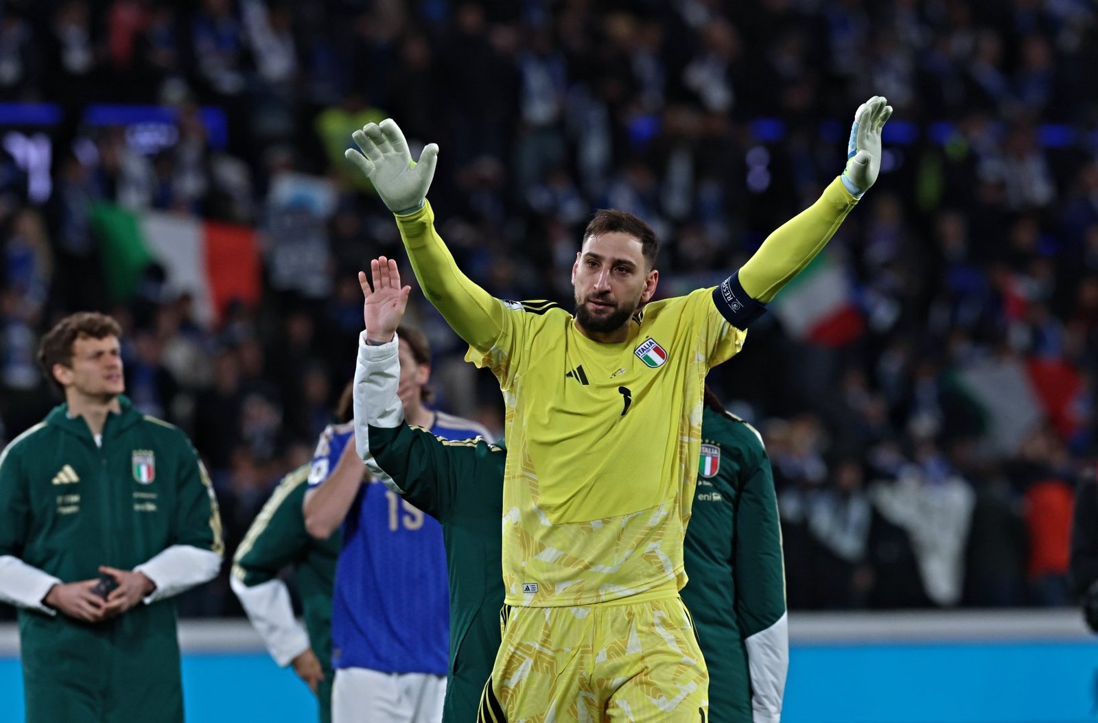 Gianluigi Donnarumma waving to Italy fans during World Cup playoffs