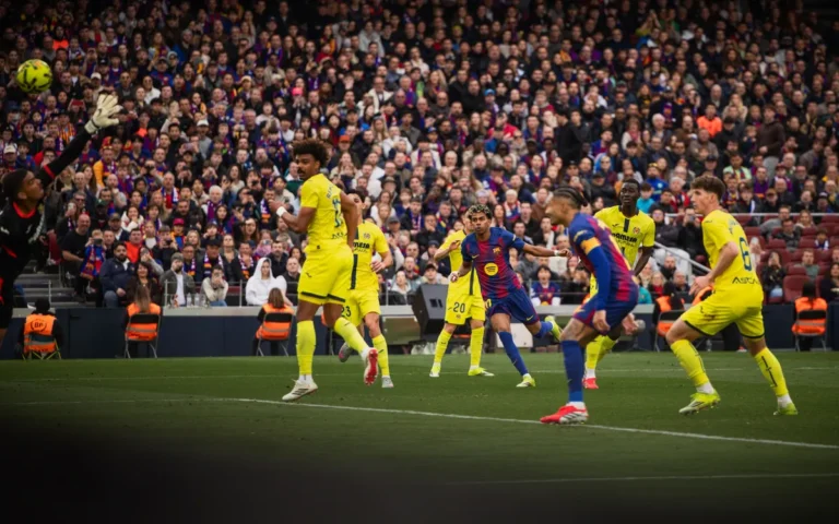 Barcelona and Villareal players vying for the ball in a La Liga game