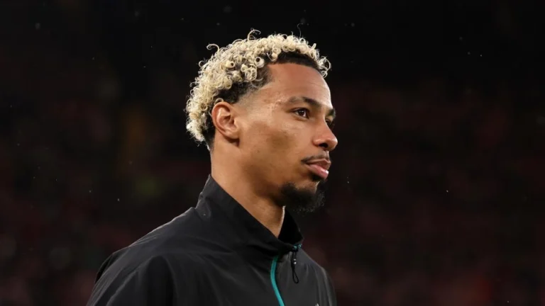 Hugo Ekitike in Liverpool outfit in a dark background