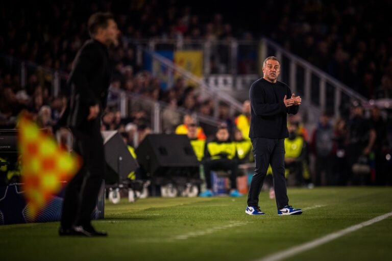 Barcelona coach Hansi Flick standing on the sidelines
