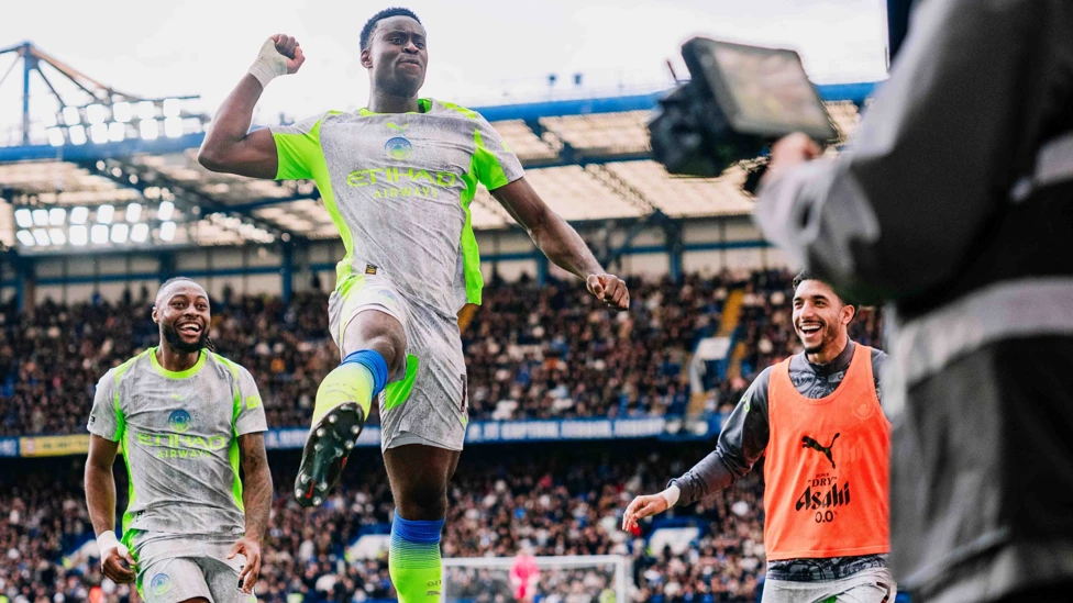Marc Guehi celebrating with his teammates after scoring for Manchester City