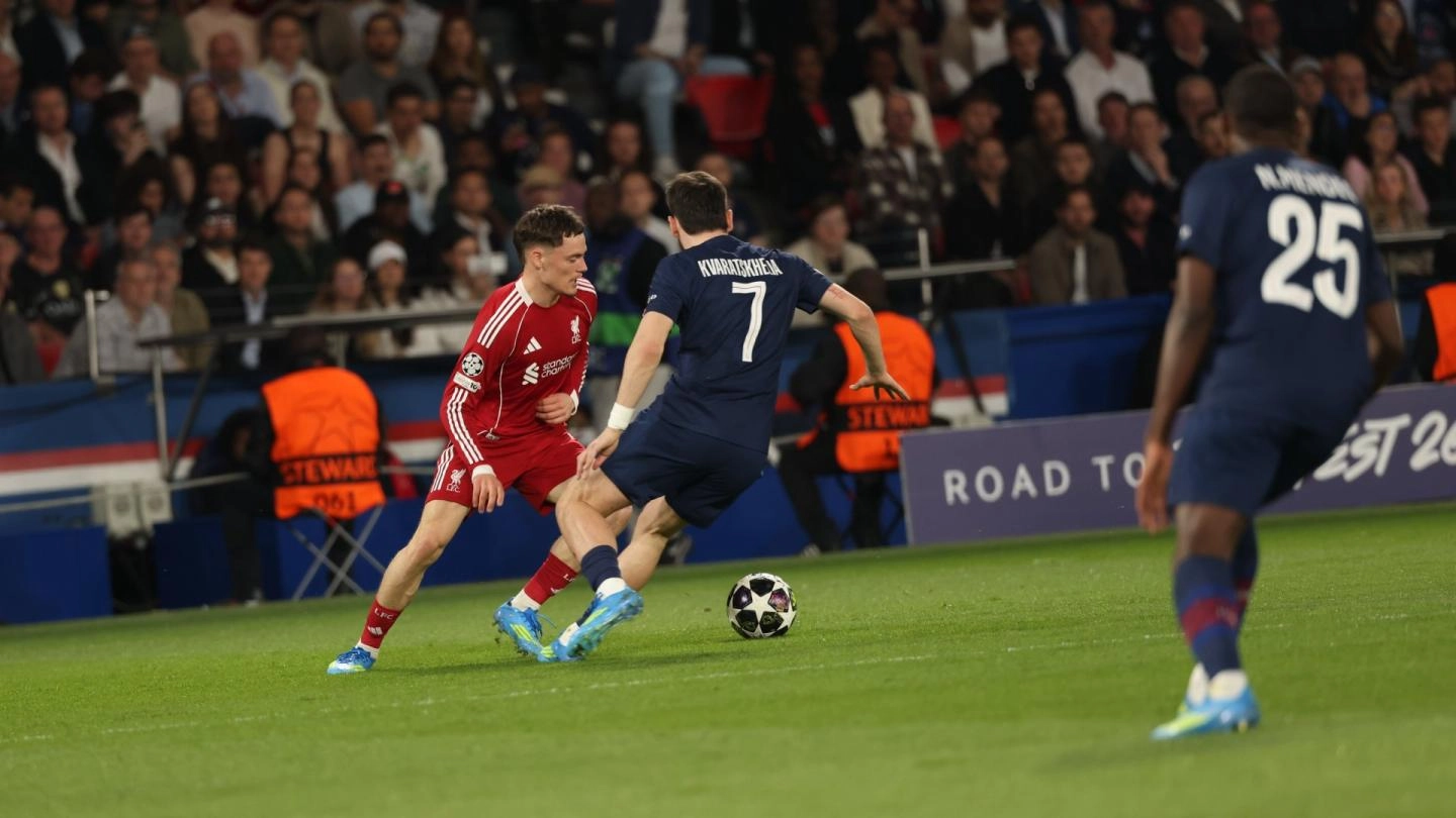 Liverpool midfielder Florian Wirtz trying to evade PSG's Kvicha Kvarat