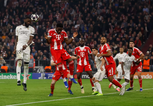 Real Madrid players vying for the ball against Bayern Munich