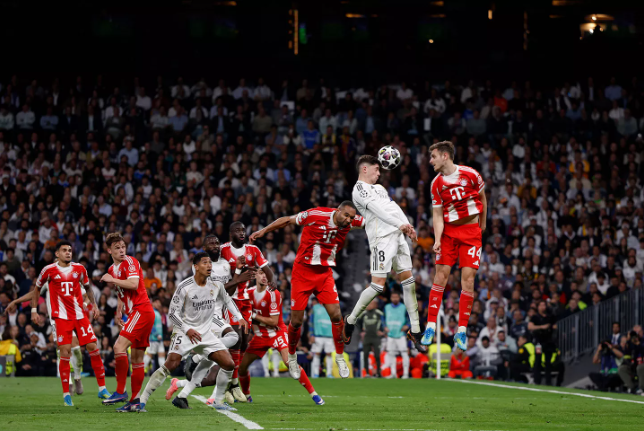 Real Madrid and Bayern Munich players vying for the ball during their Champions League quarter-final first-leg match