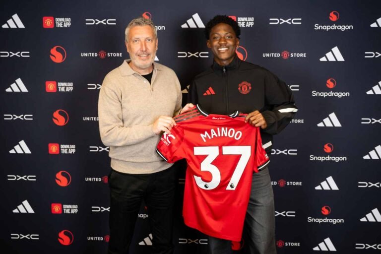 Kobbie Mainoo and Manchester United director of football Jason Wilcox both holding up a number 37 shirt after midfielder signs new contract