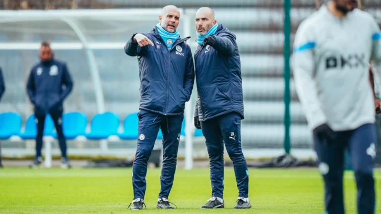 Pep Guardiola and Enzo Maresca conversing at Manchester City's training ground