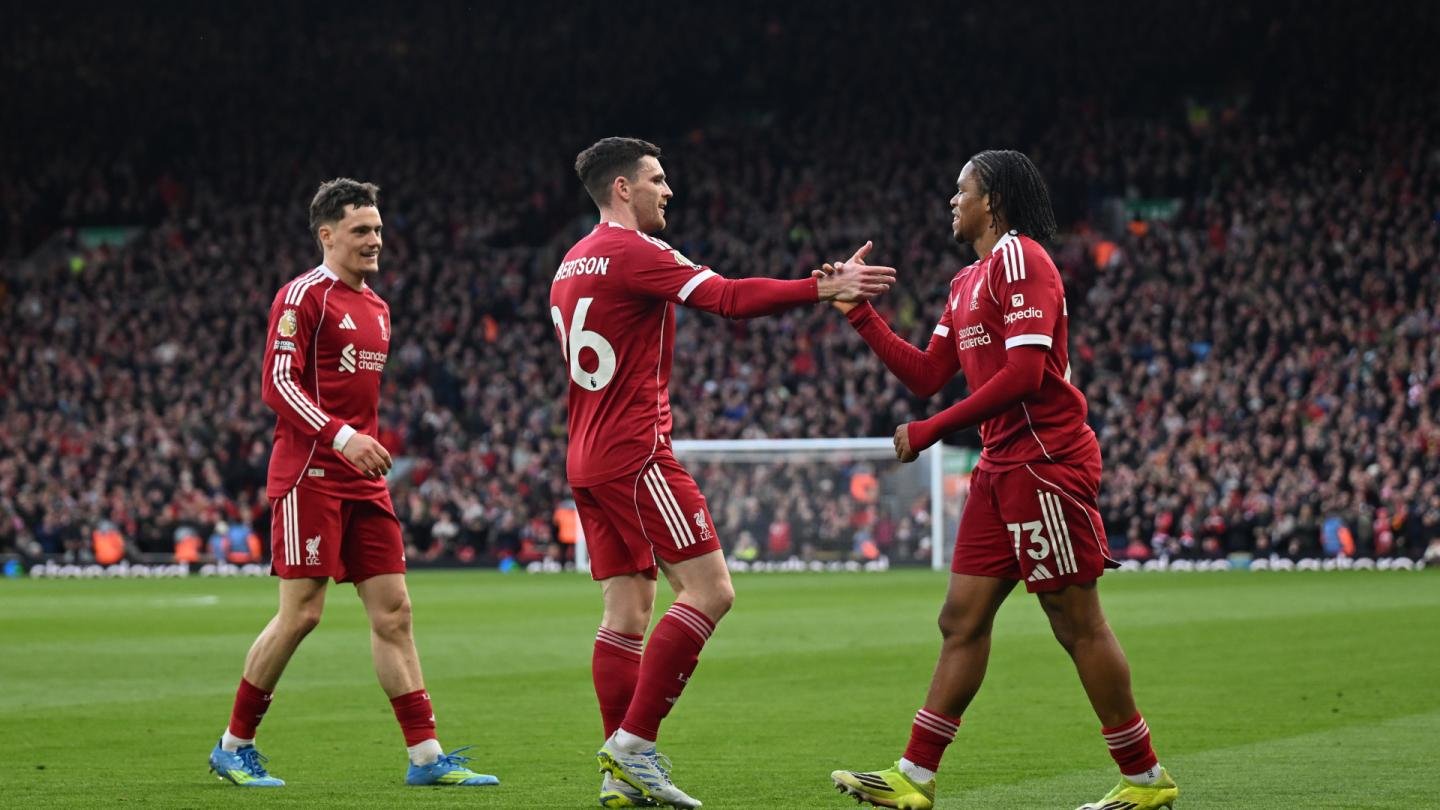 Rio Ngumoha celebrating with teammates Andy Robertson and Florian Wirtz after scoring goal for Liverpool