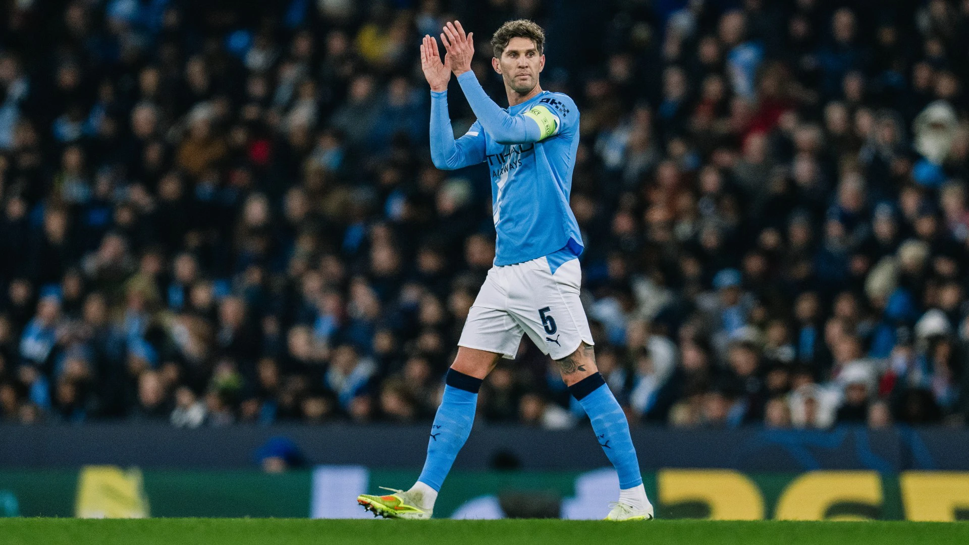 John Stones applauding Manchester City fans at the Etihad Stadium