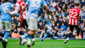 Jeremy Doku scoring goal for Manchester City against Brentford