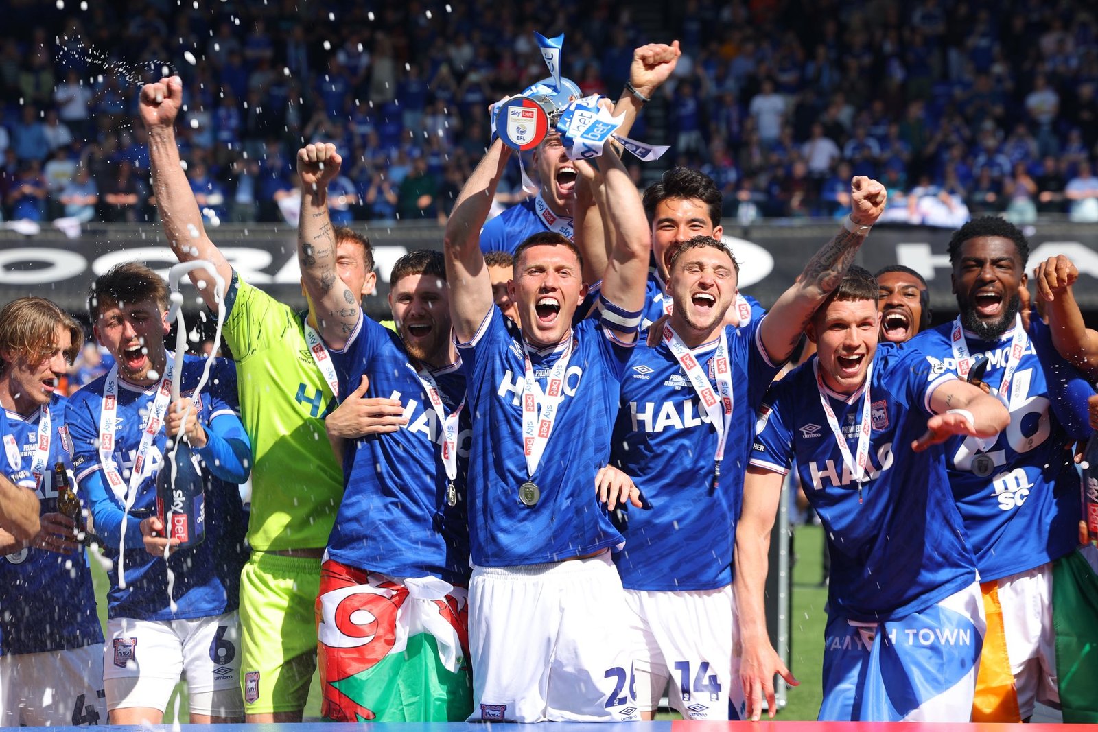 Ipswich Town players celebrating promotion back to the Premier League