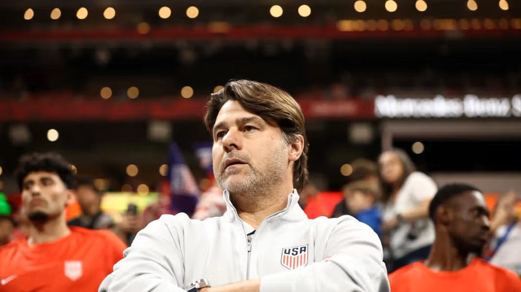 Mauricio Pochettino sitting in a stadium