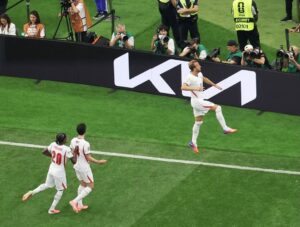 Harry Kane celebrating goal for England with teammates