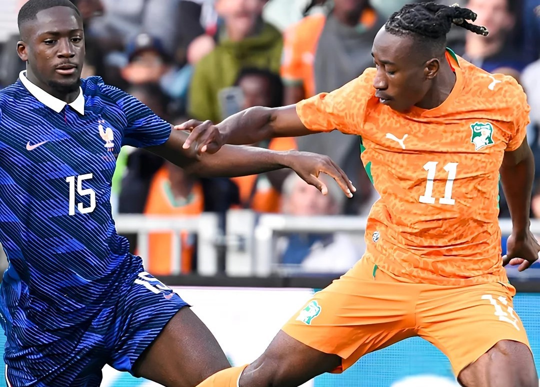 Ivory Coast's Yan Diomande competing with France's Ibrahima Konate