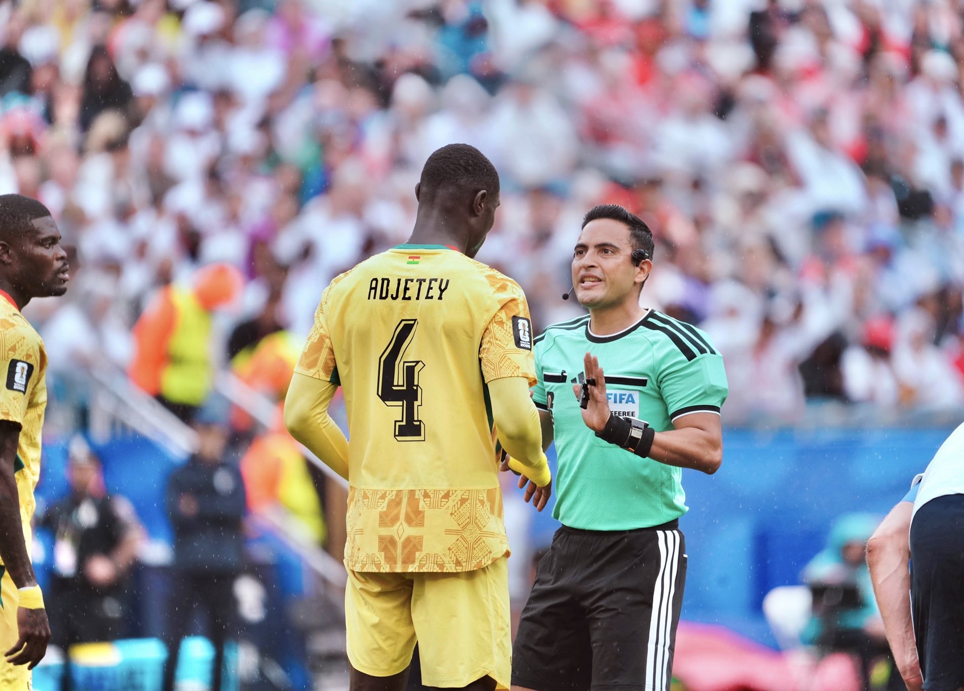 Ghana defender speaking to the referee during game against England
