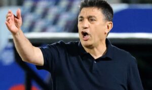 Iran coach Amir Ghalenoei directing his players at the World Cup
