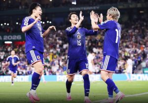Japan celebrating after win over Tunisia