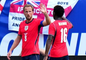 Harry Kane celebrating with Kobbie Mainoo after scoring for England against New Zealand