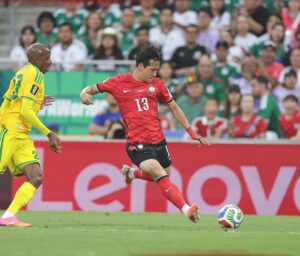 South Korea left-back Lee Tae-seok tries to evade his South African marker during their group stage match at the World Cup.