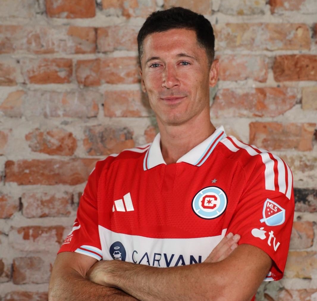 Robert Lewandowski posing after signing for Chicago Fire