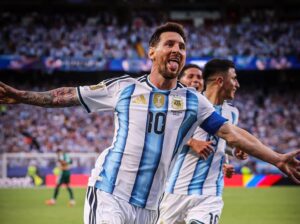 Lionel Messi celebrating with Argentina teammates after goal against Algeria