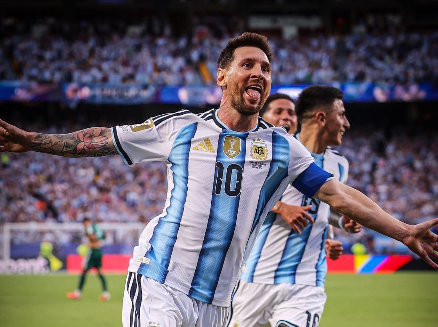 Lionel Messi celebrating with Argentina teammates after goal against Algeria