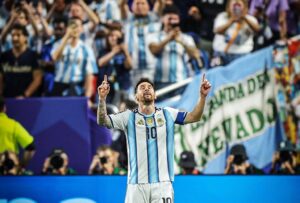 Lionel Messi celebrating in stadium after breaking record against Algeria