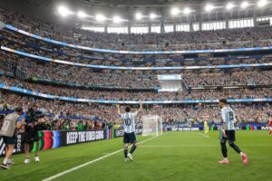 Lionel Messi celebrating in stadium after scoring for Argentina