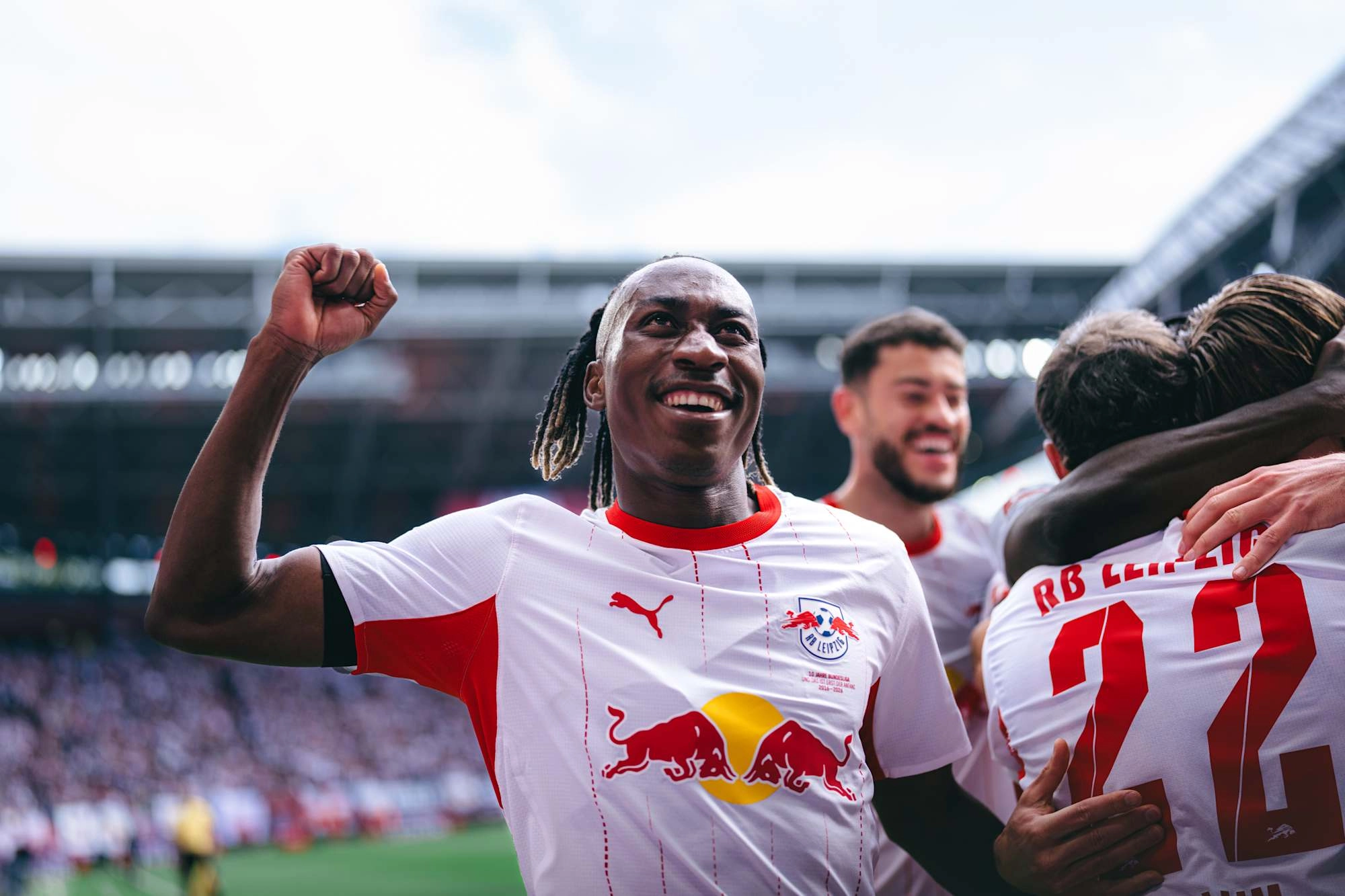 Yan Diomande celebrating an RB Leipzig goal on the pitch