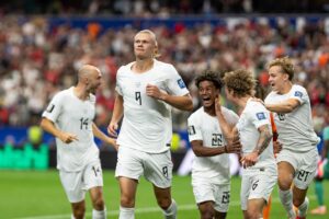 Erling Haaland celebrating with Norway teammates after goal against Ivory Coast