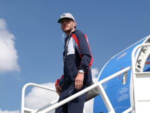 Declan Rice stepping off a plane to arrive at the England camp