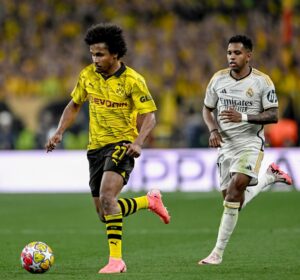 Karim Adeyemi (left) evades Real Madrid's Rodrygo