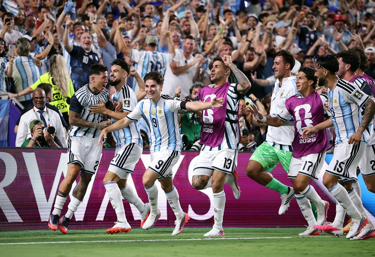 Julian Alvarez celebrating with teammates after scoring for Argentina against Switzerland