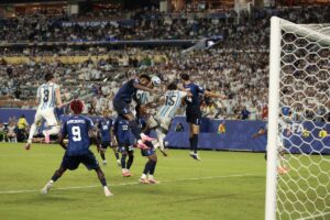 Argentina's Cristian Romero scores the decisive header against Cape Verde