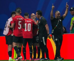 Mohamed Salah and Egypt players on the pitch during match against Argentina