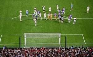 England players standing dejected after defeat to Argentina