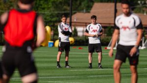 Andoni Iraola and staff coach supervising Liverpool training