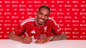 Jeremy Jaquet posing after signing contract for Liverpool