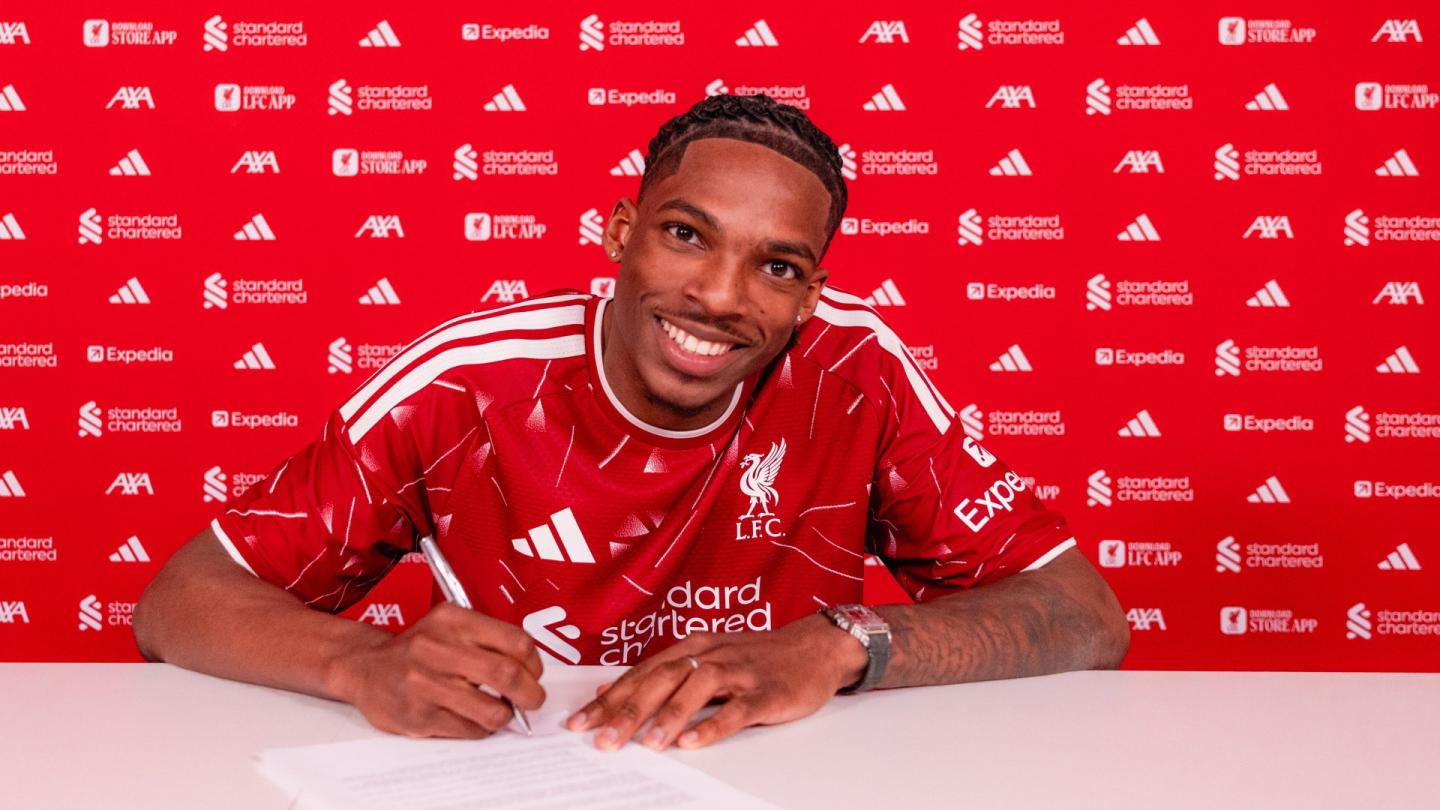 Jeremy Jaquet posing after signing contract for Liverpool