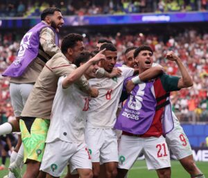 Morocco players celebrating their win over Canada