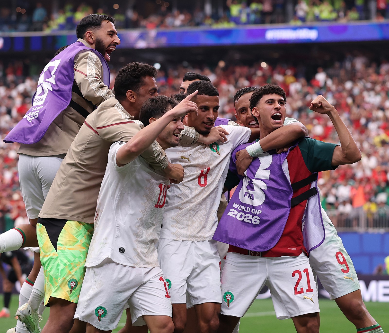 Morocco players celebrating their win over Canada